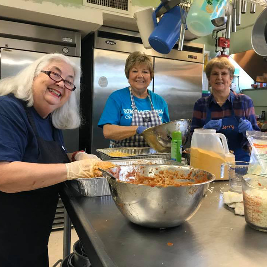 Women preparing food in church kitchen